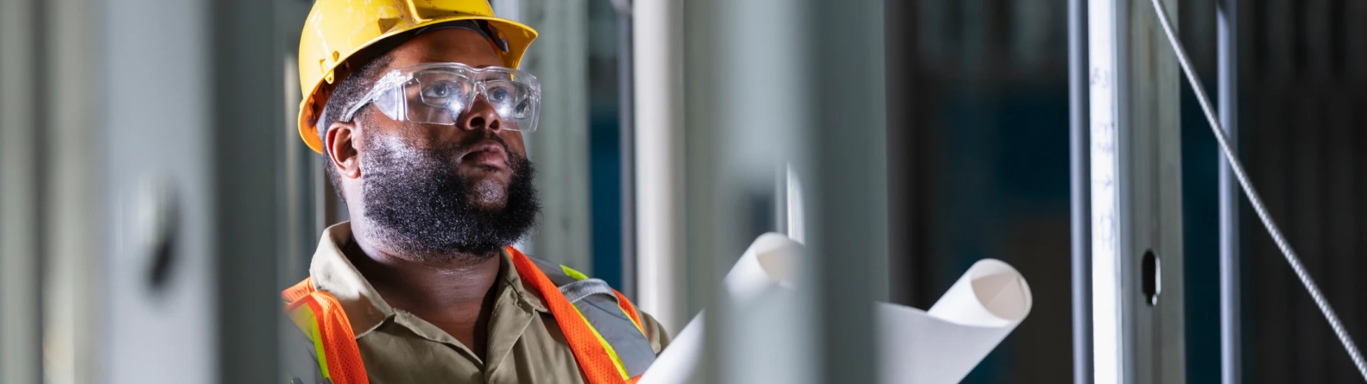 construction worker reviewing drawings
