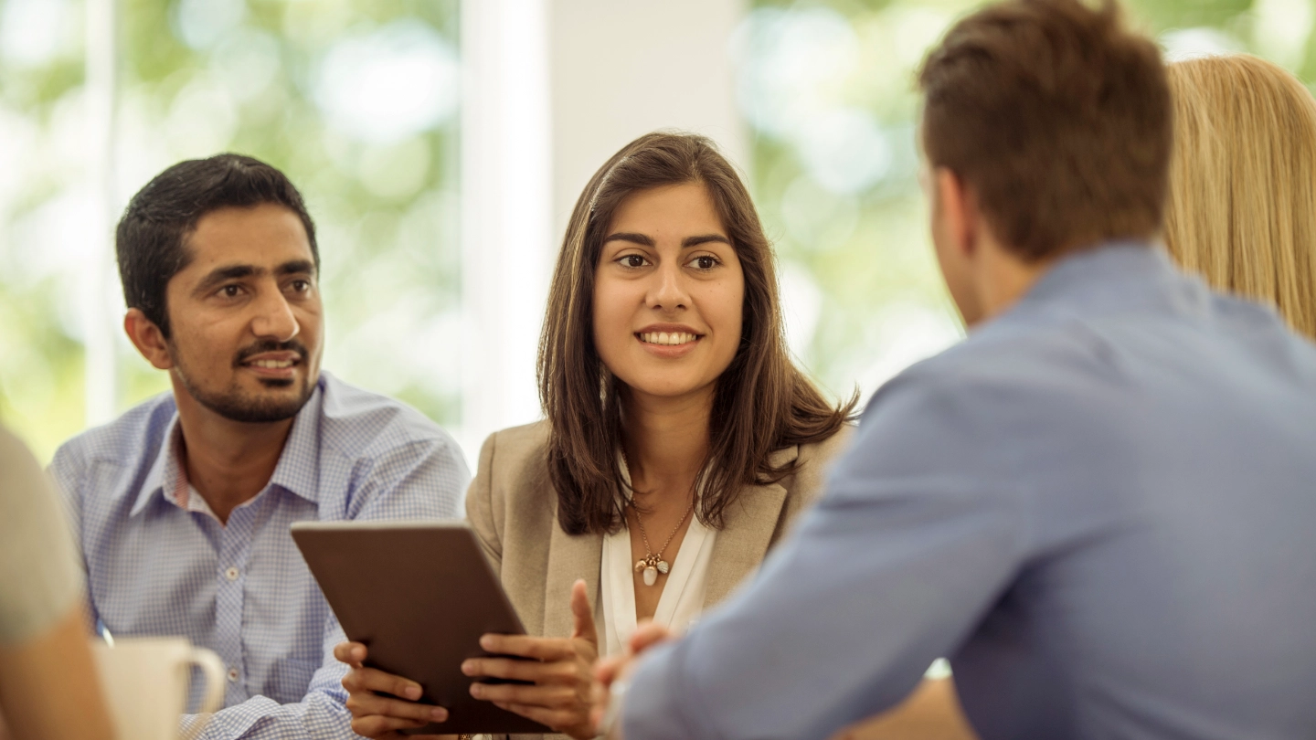 men and woman in a meeting men and woman in a meeting
